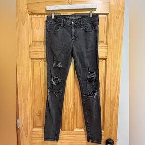 Faded black distressed jeggings